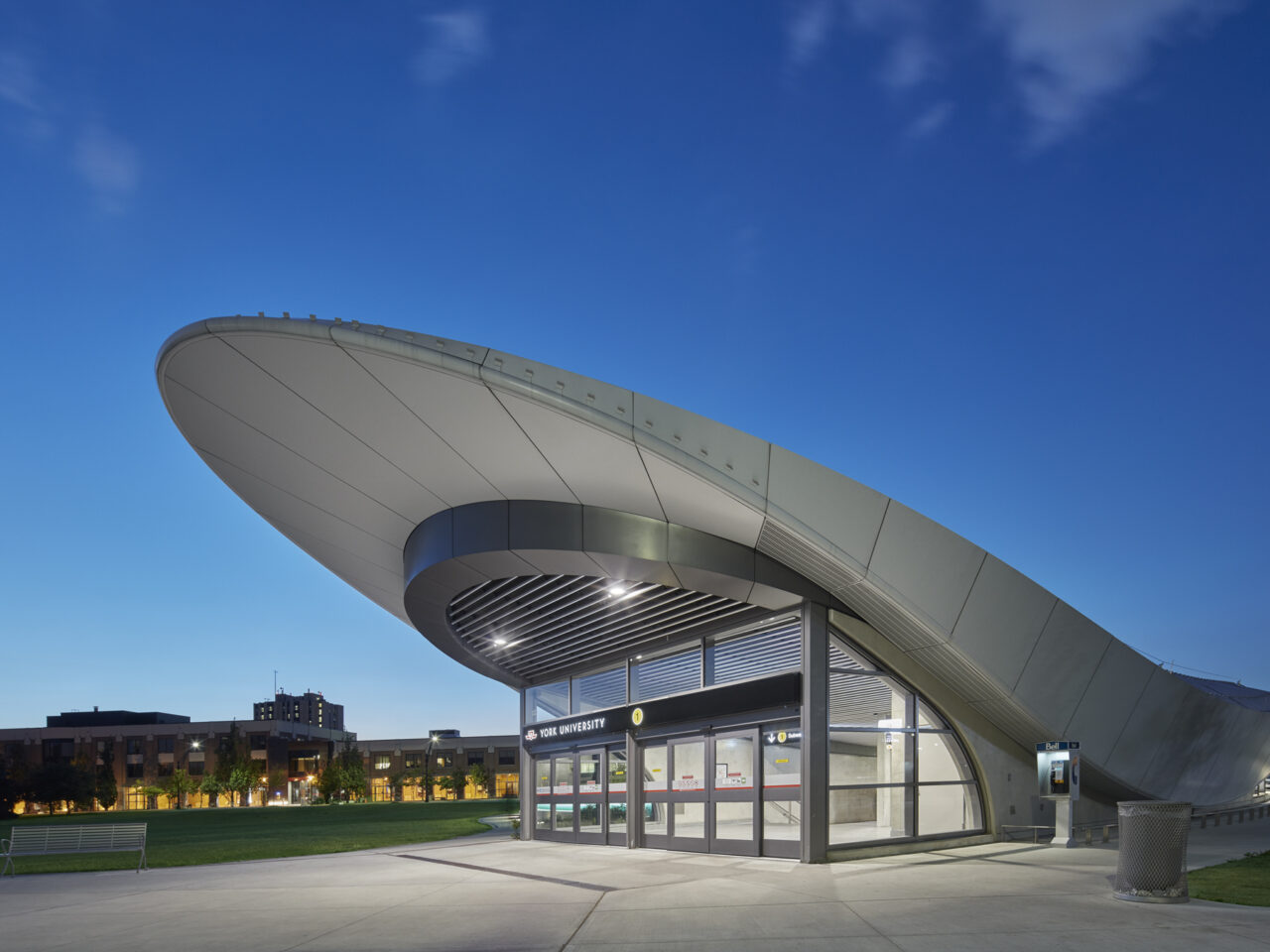 Front entrance photo of TTC York University Station in Toronto, Ontario shows curvature of the building.