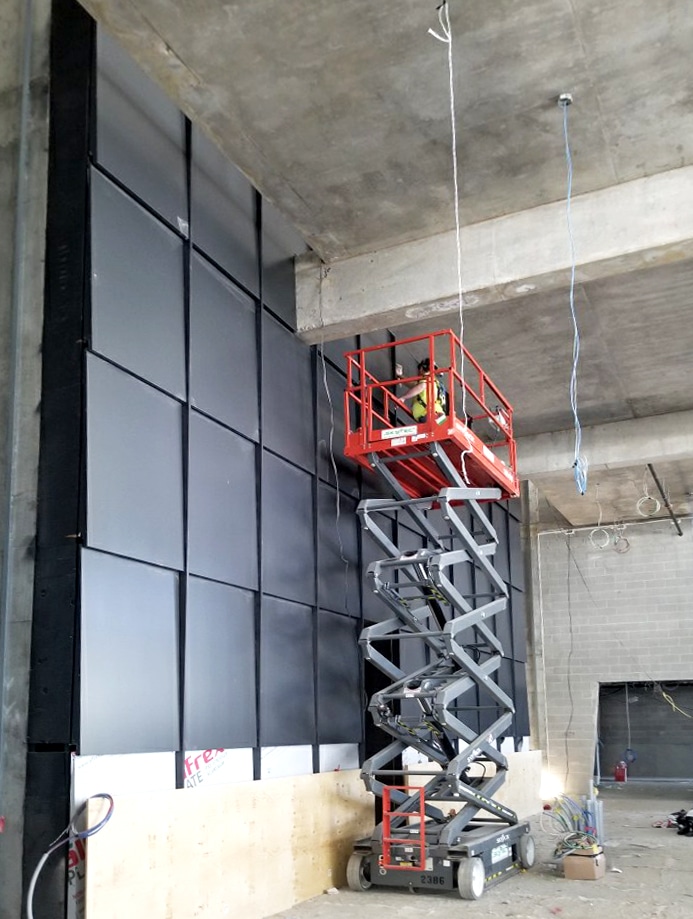 Installation of custom architectural panel system at 100 Queens Quay, Toronto by Riverside Group.