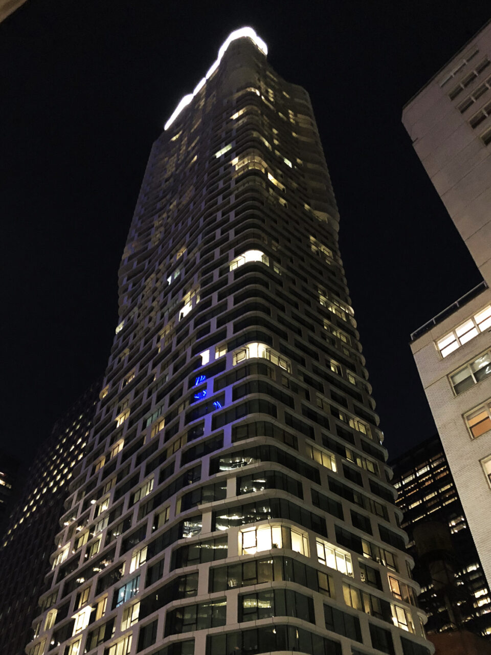Night view of 242-West-53rd Street, New York. CentraRuddy Architecture, custom unitized rainscreen system by Riverside Group.
